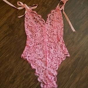 Pink one piece teddy.